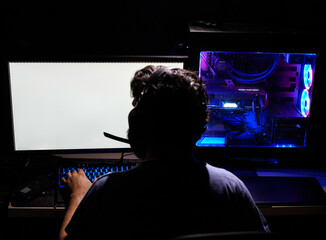colorful computer workstation and keyboard used by bearded male designer freelancer illustrator