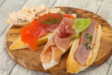 Tapas - bruschetta with prosciutto, salmon, duck and gorgonzola