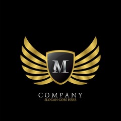Golden Wing Shield Luxury Initial Letter M logo design concept.