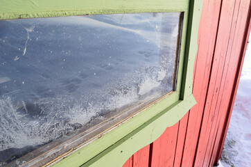 Frost on a garage window  on extremely cold winter day