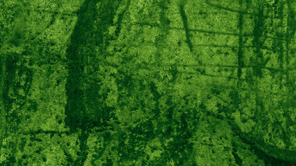 dark green background with old vintage grunge texture; abstract rough wall design with grungy paint spatter in green Christmas or St. Patrick's Day colors