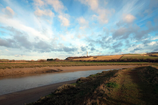 Countryside landscape of River Ader and meadow near Shoreham-by-Sea, England