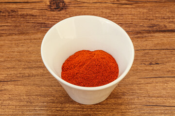 Obraz na płótnie Canvas Dry paprika powder in the bowl