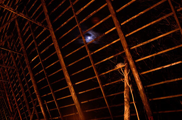 old wooden stockfish structure at night