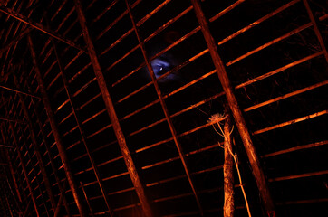 old wooden stockfish structure at night