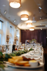 Beautiful table set made of plates, glasses and cutleries