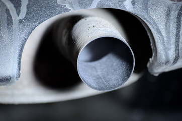 Idling car exhaust close photo