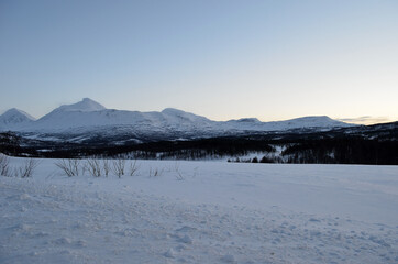 Amazing white snow covered mountain range in Norway in winter