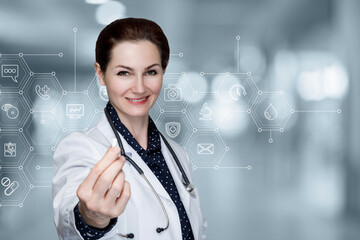 Female doctor shows medicine in pill form .