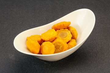 Marinated yellow patisson in the bowl