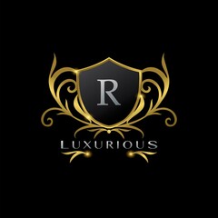 Golden Letter Q Luxurious Shield Logo, vector design concept for luxuries business identity