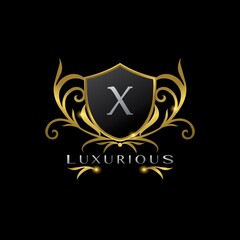 Obraz premium Golden Letter W Luxurious Shield Logo, vector design concept for luxuries business identity