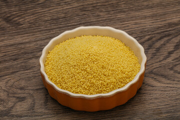 Raw cous cous heap in the bowl