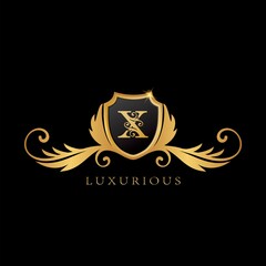 Golden X Logo Luxurious Shield logo design concept.