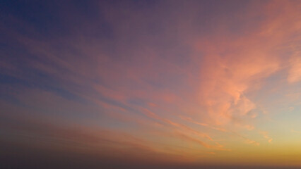 Naklejka na ściany i meble Colored clouds on sunset, amazing sky