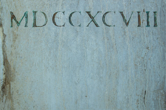 Old Roman Numerals Engraved On A Texture Stone