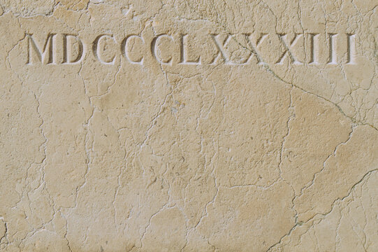 Old Roman Numerals Engraved On A Texture Stone