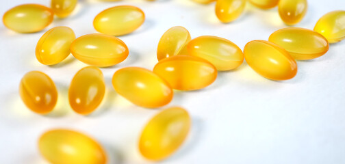fish oil capsules isolated on white background. Top view. Flat lay pattern
