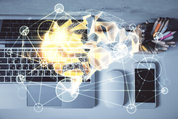 Multi exposure of brain sketch hologram over topview work table background with computer. Concept...