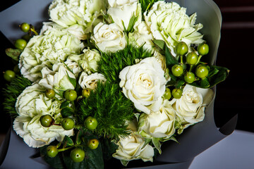 top view closeup elegant bouquet of big white roses and fresh greenery