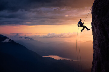 Epic Adventurous Extreme Sport Composite of Rock Climbing Man Rappelling from a Cliff. Mountain...