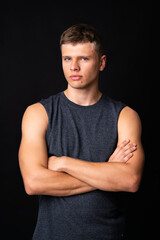 Portrait of young man over isolated black background