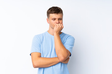 Young handsome man over isolated white background having doubts