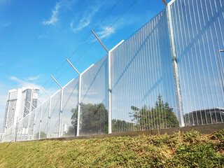 Anti-climb fencing made from galvanized iron install at the perimeter or boundary of property to prevent from the intruder. Its close nets can prevent intruders from climbing the fence. - obrazy, fototapety, plakaty