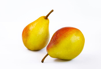 pear fruit, yellow fruits with red sides on a light background