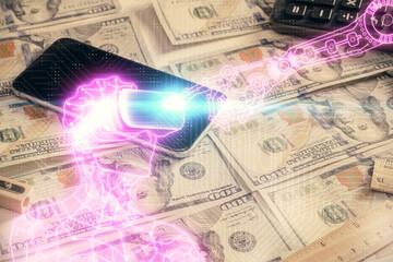 Double exposure of man wearing VR glasses drawing over usa dollars bill background. Concept of virtual reality.