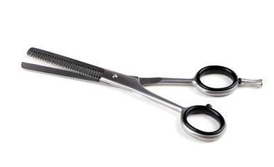 Hairdressing filer scissors isolated on a white background. Hair cutting scissors. Thinning shears. Professional shears.