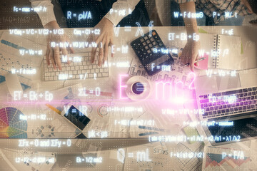 Double exposure of man and woman working together and formula hologram drawing. Computer background. Top View. Education concept.