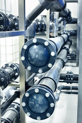 PVC pipeline an industrial city water treatment boiler room. Valves and pipe conections.