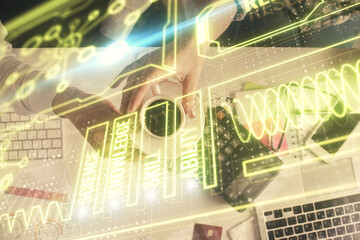 Double exposure of man and woman working together and education theme hologram drawing. Computer background. Top View.