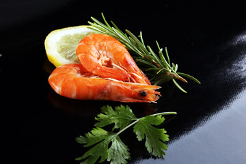 Raw fresh Prawns Langostino Austral. shrimp seafood with fresh lemon and spices.