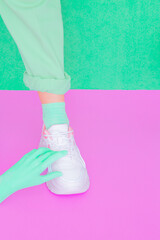  White sneakers and fake hand. Minimal pastel fashion mood concept. Vanilla design. Ideal for bloggers, websites, magazines, business owners, instagram fashion page. Trendy monochrome colours