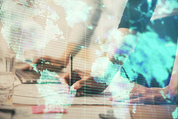 Double exposure of woman hands typing on computer and business theme hologram drawing. Success...