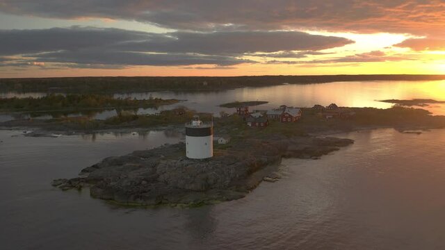 Flying toward an island in the archipelago during a beautiful sunset