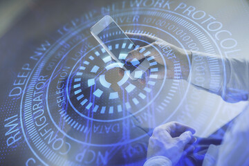Double exposure of man's hand holding and using a digital device and data theme drawing. Technology concept.