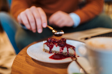 Eating delicious dessert, close up.