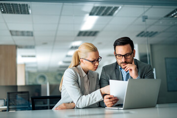 Serious business people working in the office.