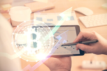 Double exposure of man's hands holding and using a phone and crypto currency blockchain theme drawing.