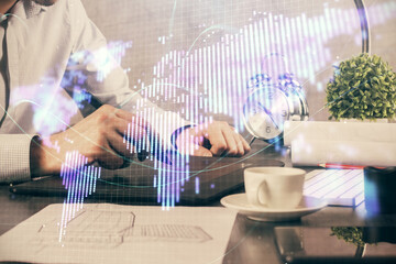 Double exposure of man's hands holding and using a phone and international business theme drawing.