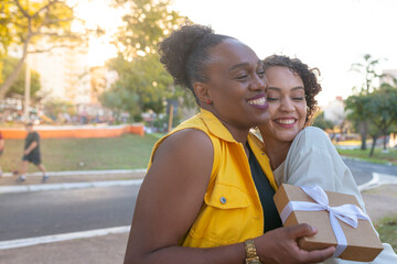 Young girl delivering gift to her mother.