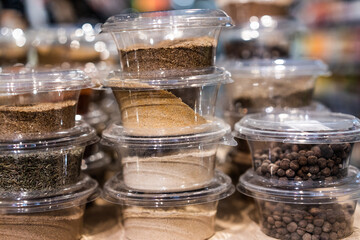 various spices and herbs packed in small transparent plastic boxes