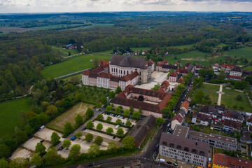 Fototapeta na wymiar Aerial view of the city and monastery Wiblingen in Germany on a sunny spring day during the coronavirus lockdown. 