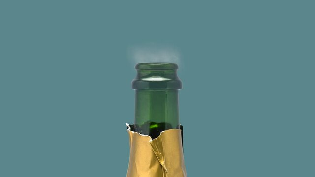 A Cork Popping On A Bottle Of Champagne Against A Striking Blue Background