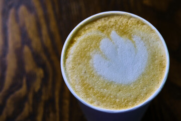 cappuccino in a paper glass view from above color