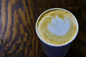 cappuccino in a paper glass view from above color