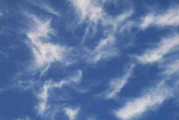 ragged clouds in the blue sky